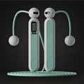 GYMFINDSHUB cordless weighted jump rope with digital display, mint green and grey ergonomic handles for home fitness.