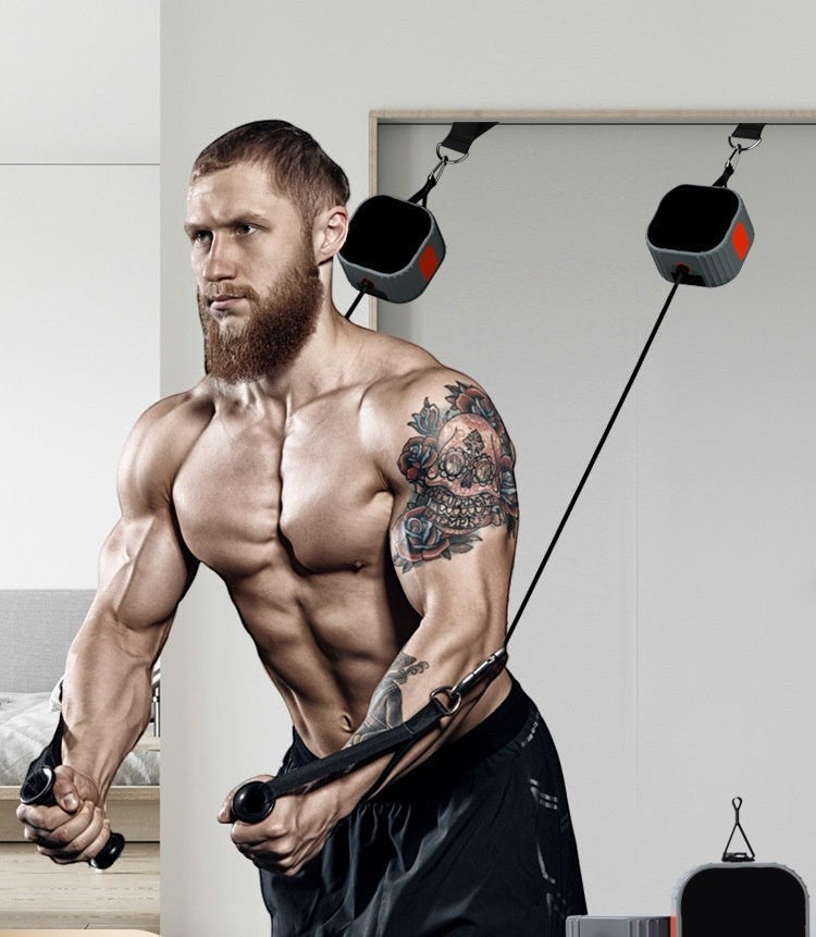 GYMFINDSHUB portable resistance cable system used by a muscular man for chest exercises in a home gym setting.
